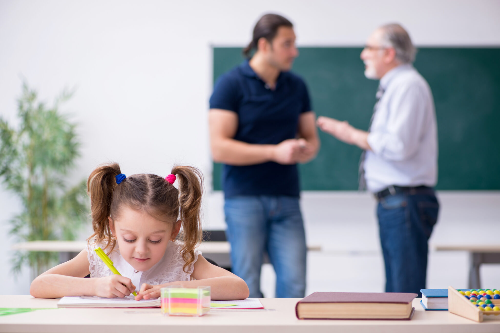 Young parent, old male teacher and little girl in the classroom | A ...